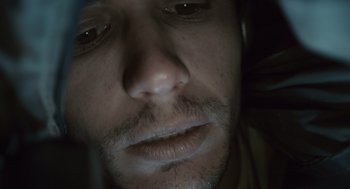 Movie still from “127 Hours” (2010), directed by Danny Boyle – A man's eyes and face; Extreme Close Up shot, Overhead angle