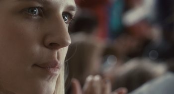 Movie still from “127 Hours” (2010), directed by Danny Boyle – A woman's face with a cup in her hand; Extreme Close Up shot, Low angle