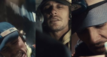 Movie still from “127 Hours” (2010), directed by Danny Boyle – A person wearing a hat; Extreme Close Up shot, Overhead angle