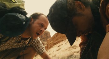 Movie still from “127 Hours” (2010), directed by Danny Boyle – A man and a woman in the desert looking into each other's eyes; Medium shot, Over the shoulder angle