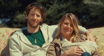 Movie still from “127 Hours” (2010), directed by Danny Boyle – A man and a woman sitting next to each other; Close Up shot, Low angle