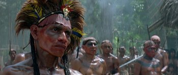 A group of men in native dress standing in a line