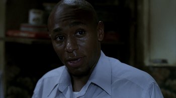 Movie still from “16 Blocks” (2006), directed by Richard Donner – A person wearing a white shirt; Close Up shot, High angle