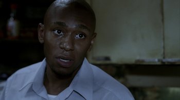 Movie still from “16 Blocks” (2006), directed by Richard Donner – A person wearing a white shirt; Close Up shot, Over the shoulder angle