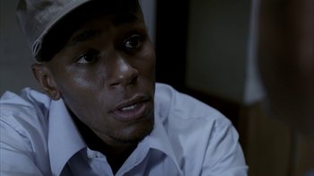 Movie still from “16 Blocks” (2006), directed by Richard Donner – A person wearing a hat; Close Up shot, Overhead angle