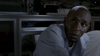 Movie still from “16 Blocks” (2006), directed by Richard Donner – A man sitting in front of a computer monitor; Close Up shot, High angle