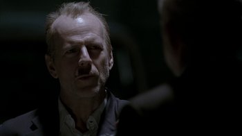 Movie still from “16 Blocks” (2006), directed by Richard Donner – A person talking to another person; Close Up shot, Over the shoulder angle