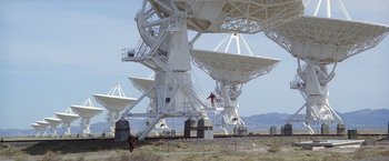 Movie still from “2010: The Year We Make Contact” (1984), directed by Peter Hyams – A man standing on top of a platform next to a satellite dish; Extreme Wide shot, High angle