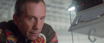 Movie still from “2010: The Year We Make Contact” (1984), directed by Peter Hyams – A person wearing a military uniform; Close Up shot, Low angle