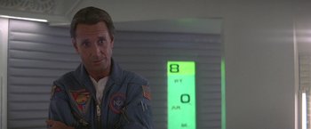 Movie still from “2010: The Year We Make Contact” (1984), directed by Peter Hyams – A person wearing a space suit; Close Up shot, Low angle