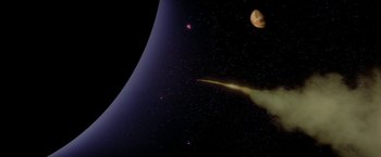 Movie still from “2010: The Year We Make Contact” (1984), directed by Peter Hyams – An image of an asteroid in the night sky; Extreme Wide shot, Overhead angle