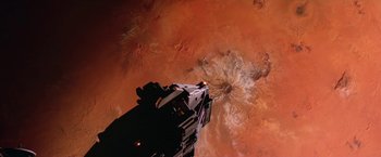 Movie still from “2010: The Year We Make Contact” (1984), directed by Peter Hyams – An aerial view of a space ship in the middle of a desert; Extreme Wide shot, Overhead angle
