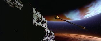 Movie still from “2010: The Year We Make Contact” (1984), directed by Peter Hyams – An image of a space station in the middle of the night; Extreme Wide shot, Low angle