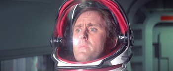 Movie still from “2010: The Year We Make Contact” (1984), directed by Peter Hyams – A person wearing a space suit; Close Up shot, Low angle