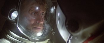 Movie still from “2010: The Year We Make Contact” (1984), directed by Peter Hyams – A person wearing a helmet; Close Up shot, Overhead angle