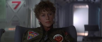 Movie still from “2010: The Year We Make Contact” (1984), directed by Peter Hyams – A person wearing a jacket; Close Up shot, Over the shoulder angle