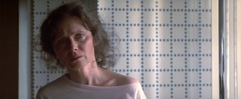 Movie still from “2010: The Year We Make Contact” (1984), directed by Peter Hyams – A person wearing a white shirt; Close Up shot, Over the shoulder angle