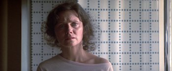 Movie still from “2010: The Year We Make Contact” (1984), directed by Peter Hyams – A person wearing a white t - shirt; Close Up shot, Low angle