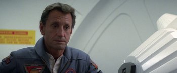 Movie still from “2010: The Year We Make Contact” (1984), directed by Peter Hyams – A person wearing a jacket; Close Up shot, High angle