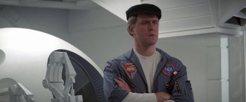 Movie still from “2010: The Year We Make Contact” (1984), directed by Peter Hyams – A man wearing a hat and a uniform; Close Up shot, Low angle