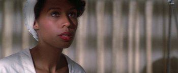 Movie still from “2010: The Year We Make Contact” (1984), directed by Peter Hyams – A person looking at the camera; Close Up shot, Over the shoulder angle