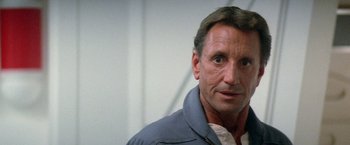 Movie still from “2010: The Year We Make Contact” (1984), directed by Peter Hyams – A person wearing a jacket; Close Up shot, Low angle