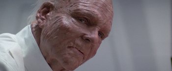 Movie still from “2010: The Year We Make Contact” (1984), directed by Peter Hyams – An old man with a bald head and a wrinkled face; Extreme Close Up shot, Low angle