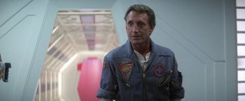 Movie still from “2010: The Year We Make Contact” (1984), directed by Peter Hyams – A person wearing a jacket; Close Up shot, Low angle