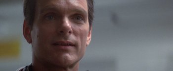 Movie still from “2010: The Year We Make Contact” (1984), directed by Peter Hyams – A man's face in a room; Close Up shot, Low angle