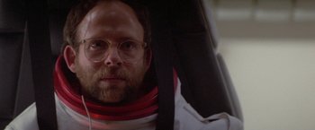 Movie still from “2010: The Year We Make Contact” (1984), directed by Peter Hyams – A person wearing a neck brace; Close Up shot, Low angle