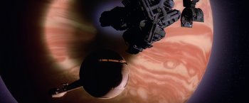 Movie still from “2010: The Year We Make Contact” (1984), directed by Peter Hyams – An image of a space ship in the sky; Extreme Wide shot, Overhead angle