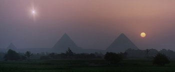 Movie still from “2010: The Year We Make Contact” (1984), directed by Peter Hyams – A view of the great pyramids of gizeh at sunset; Extreme Wide shot, Low angle