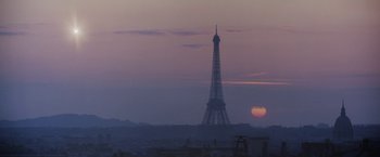 Movie still from “2010: The Year We Make Contact” (1984), directed by Peter Hyams – The sun sets behind the eiffel tower in paris; Extreme Wide shot, Low angle