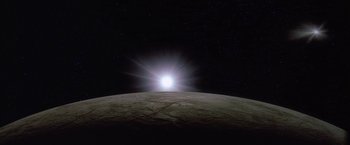 Movie still from “2010: The Year We Make Contact” (1984), directed by Peter Hyams – A view of the sun from the moon at night; Extreme Wide shot, Low angle