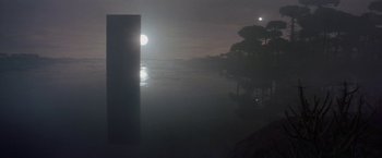 Movie still from “2010: The Year We Make Contact” (1984), directed by Peter Hyams – A full moon rises over a body of water; Extreme Wide shot, Low angle
