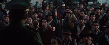 Movie still from “2012” (2009), directed by Roland Emmerich – A large group of people standing together in a crowd; Wide shot, High angle