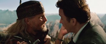 Movie still from “2012” (2009), directed by Roland Emmerich – A man and a woman talking to each other; Close Up shot, Over the shoulder angle