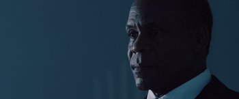 Movie still from “2012” (2009), directed by Roland Emmerich – A man's face in the dark; Close Up shot, Low angle