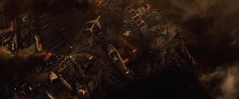 Movie still from “2012” (2009), directed by Roland Emmerich – An aerial view of an industrial area at night; Extreme Wide shot, Overhead angle