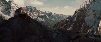 Movie still from “2012” (2009), directed by Roland Emmerich – A view of a mountain range with snow on it's tops; Extreme Wide shot, High angle