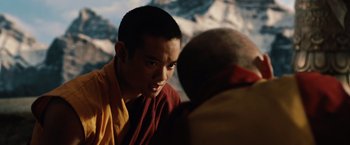 Movie still from “2012” (2009), directed by Roland Emmerich – A young man is talking to an older man; Close Up shot, Over the shoulder angle