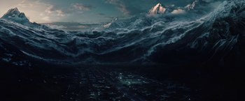 Movie still from “2012” (2009), directed by Roland Emmerich – An aerial view of a city and mountains in the background; Extreme Wide shot, High angle