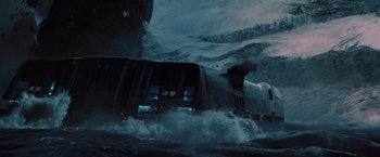 Movie still from “2012” (2009), directed by Roland Emmerich – A train traveling through the middle of the ocean; Extreme Wide shot, Low angle