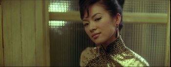 Movie still from “2046” (2004), directed by Kar-Wai Wong – A woman in a leopard print dress looking to her left; Close Up shot, Low angle