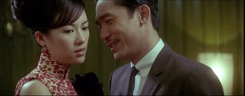 Movie still from “2046” (2004), directed by Kar-Wai Wong – A man and a woman are looking at one another; Close Up shot, Low angle