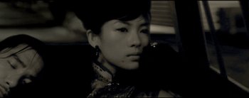 Movie still from “2046” (2004), directed by Kar-Wai Wong – A black and white photo of a woman in a dress; Close Up shot, High angle