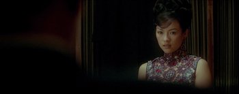 Movie still from “2046” (2004), directed by Kar-Wai Wong – A beautiful young woman in a floral dress; Close Up shot, Over the shoulder angle
