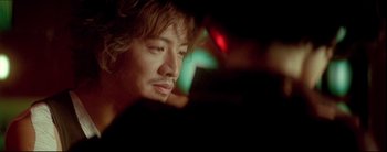 Movie still from “2046” (2004), directed by Kar-Wai Wong – A person with long hair; Close Up shot, Low angle