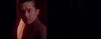 Movie still from “2046” (2004), directed by Kar-Wai Wong – A person wearing a jacket; Close Up shot, Over the shoulder angle