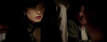 Movie still from “2046” (2004), directed by Kar-Wai Wong – A person wearing a hat; Close Up shot, Over the shoulder angle